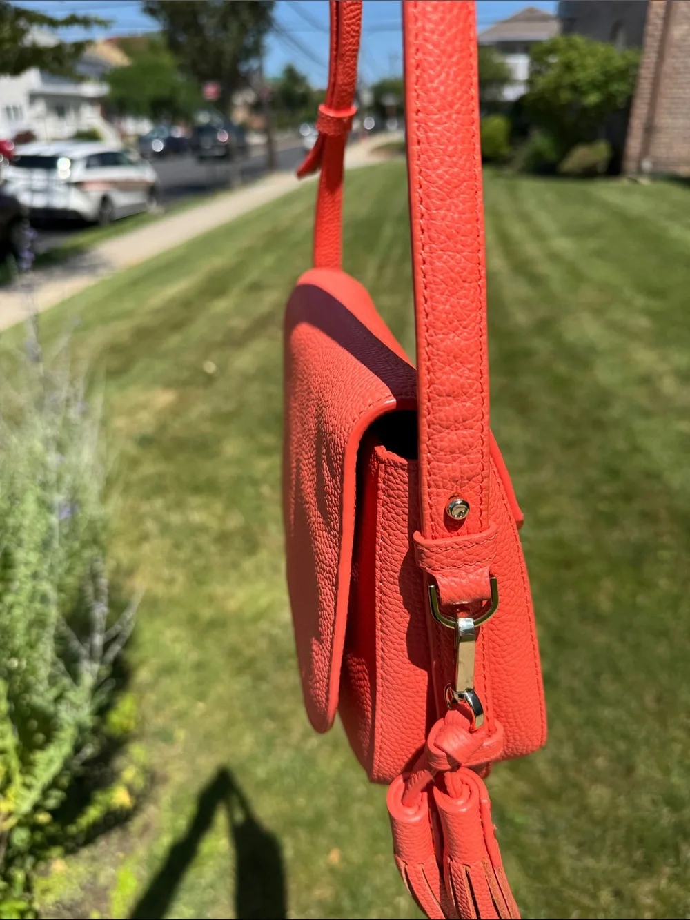 kate spade coral orange pebbled leather crossbody with tassels
